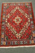A Iranian rug of geometric design 142 cm x 102 cm