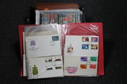 A basket of stamp albums,