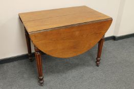 A Victorian mahogany extending flap sided table