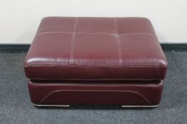 A Burgundy leather footstool