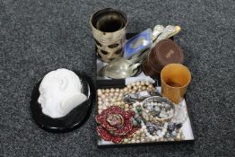 An assortment of collectables to include Mauchline ware cup, dress studs, cutlery,