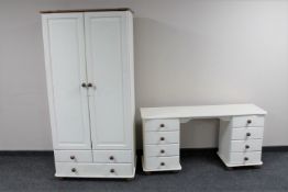 A painted pine double door wardrobe fitted three drawers together with a painted pine eight drawer