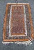 An Afghan Balouch rug 174 cm x 100 cm