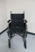 A folding lightweight wheel chair