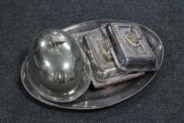 An antique silver plated meat tray together with two silver plated entree dishes with covers and a