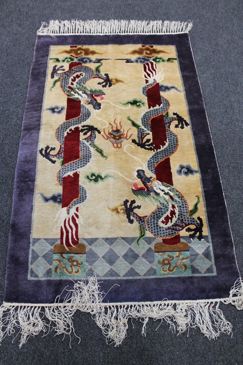 A Chinese rug depicting dragons,