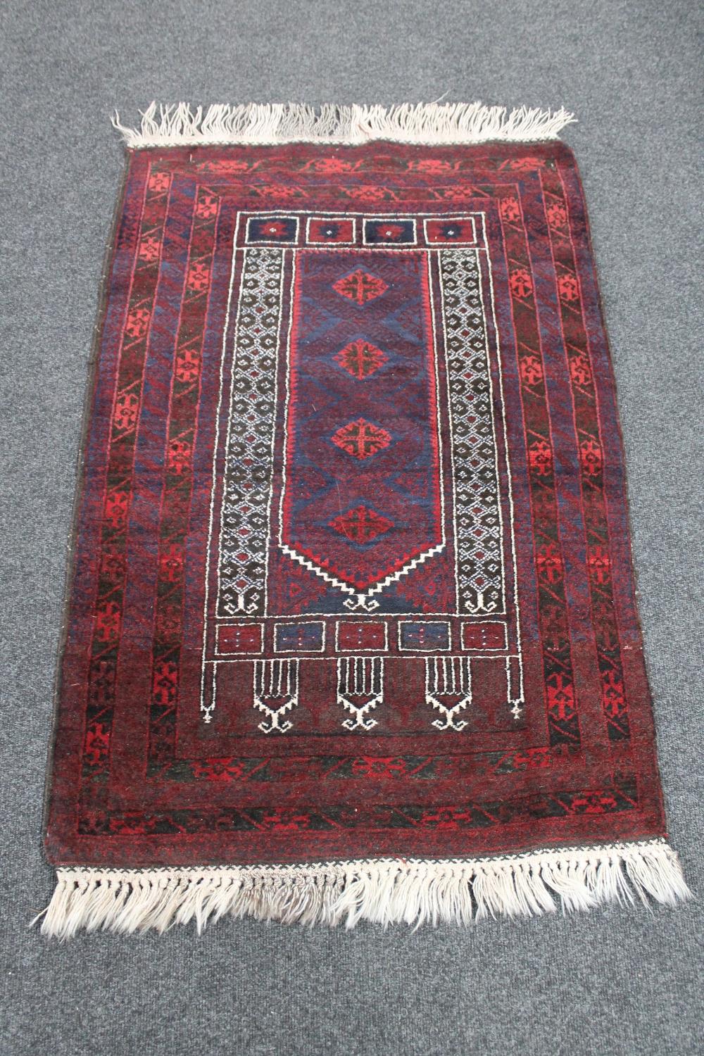 An Afghan prayer rug 143 cm x 85 cm