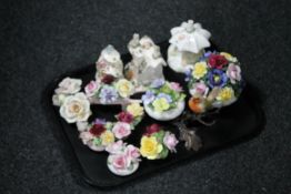 A tray of three china pastille burners together with eight assorted china flower posies and a china