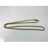 A yellow metal rope twist chain, marked 'Swarovski', 8.6g.