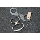 A pair of 20th century Hiatts hand cuffs and restraints