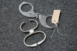 A pair of 20th century Hiatts hand cuffs and restraints