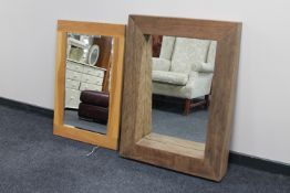 A contemporary oak framed bevelled mirror together with a heavy pine framed mirror