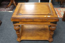 A colonial style two tier coffee table