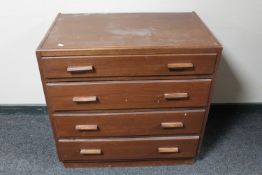 A mid 20th century oak four drawer chest