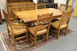 A good quality oak eight piece dining room suite comprising refectory table (length 168 cm,