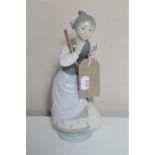 A Lladro figure - girl with broom