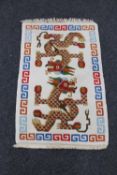 A Chinese rug depicting dragons,