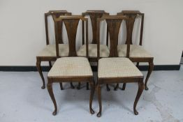 A set of five continental oak dining chairs
