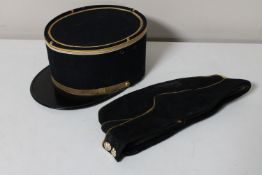 A vintage French police hat together with an early 20th century military hat