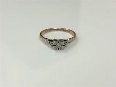 An early twentieth century diamond set 9ct and palladium mounted ring, 1.6g, size K.