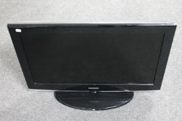 A Samsung 32" LCD TV with remote