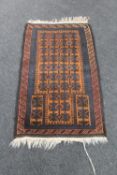 An Afghan Balouch rug 145 cm x 75 cm