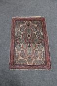 A Persian prayer rug 79 cm x 56 cm