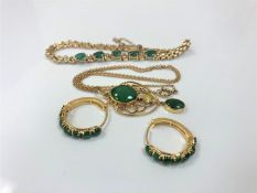 A suite of yellow gold and emerald jewellery comprising of emerald and diamond bracelet in 14ct