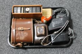 A tray containing leather cased binoculars, vintage camera, pipe, ivory fronted dominoes,