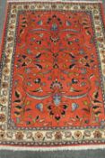 A Malayer rug, on salmon ground,