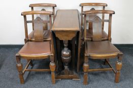 A 1930's oak drop leaf table together with four chairs CONDITION REPORT: 91cm long