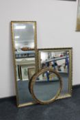 A circular gilt framed mirror together with a gilt framed bevelled hall mirror and one other mirror