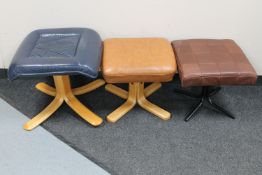 Three square leather upholstered footstools