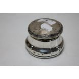 A silver lidded dressing table pot,