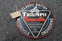 A cast iron Triumph Bonneville Motorcycles plaque