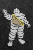 A cast iron Michelin man sign