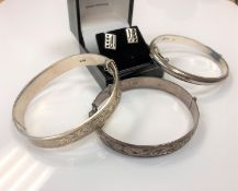 Three silver bangles and a pair of Charles Rennie Mackintosh inspired silver earrings