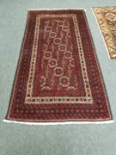 A Persian rug, on red ground,