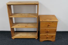 A pine three drawer chest together with a set of pine open bookshelves