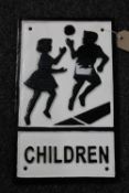 A cast iron Children Crossing sign