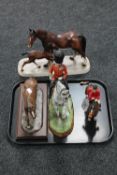 A tray containing a cream ware figure of a horse on wooden stand, huntsman on horse,