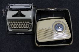 A Bush retro style radio together with an Adler Junior 3 cased typewriter