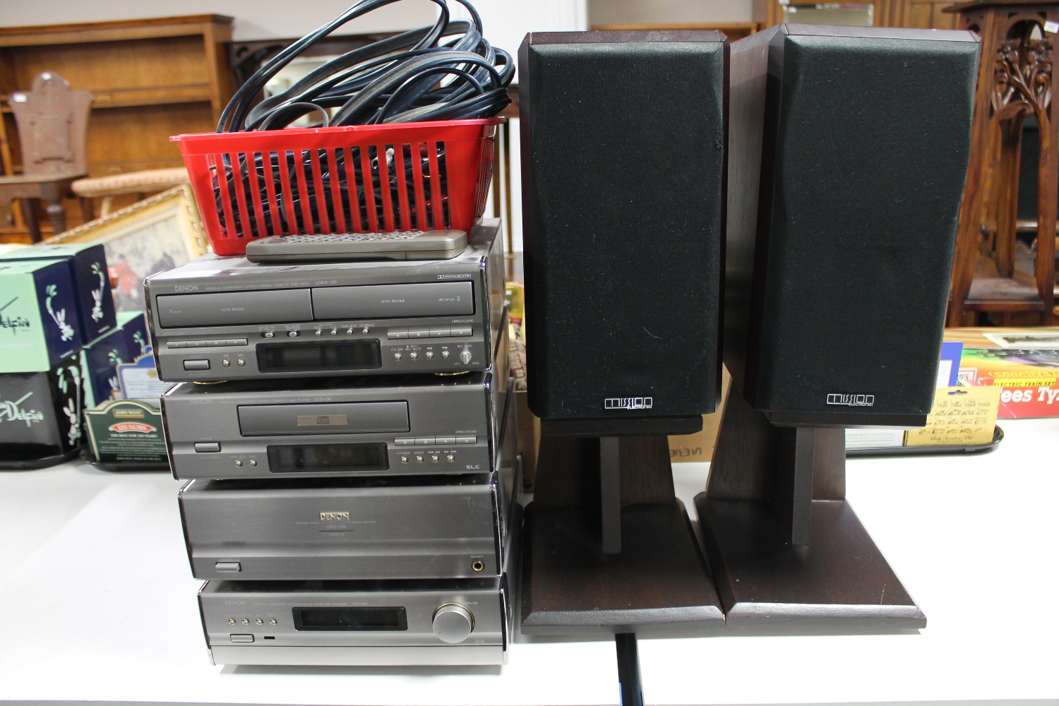 A Denon four piece hifi system with speakers on stand,