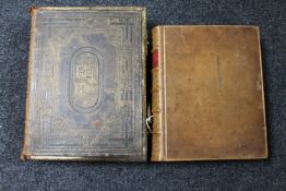 A 19th century leather bound bible and an antique Websters English Dictionary