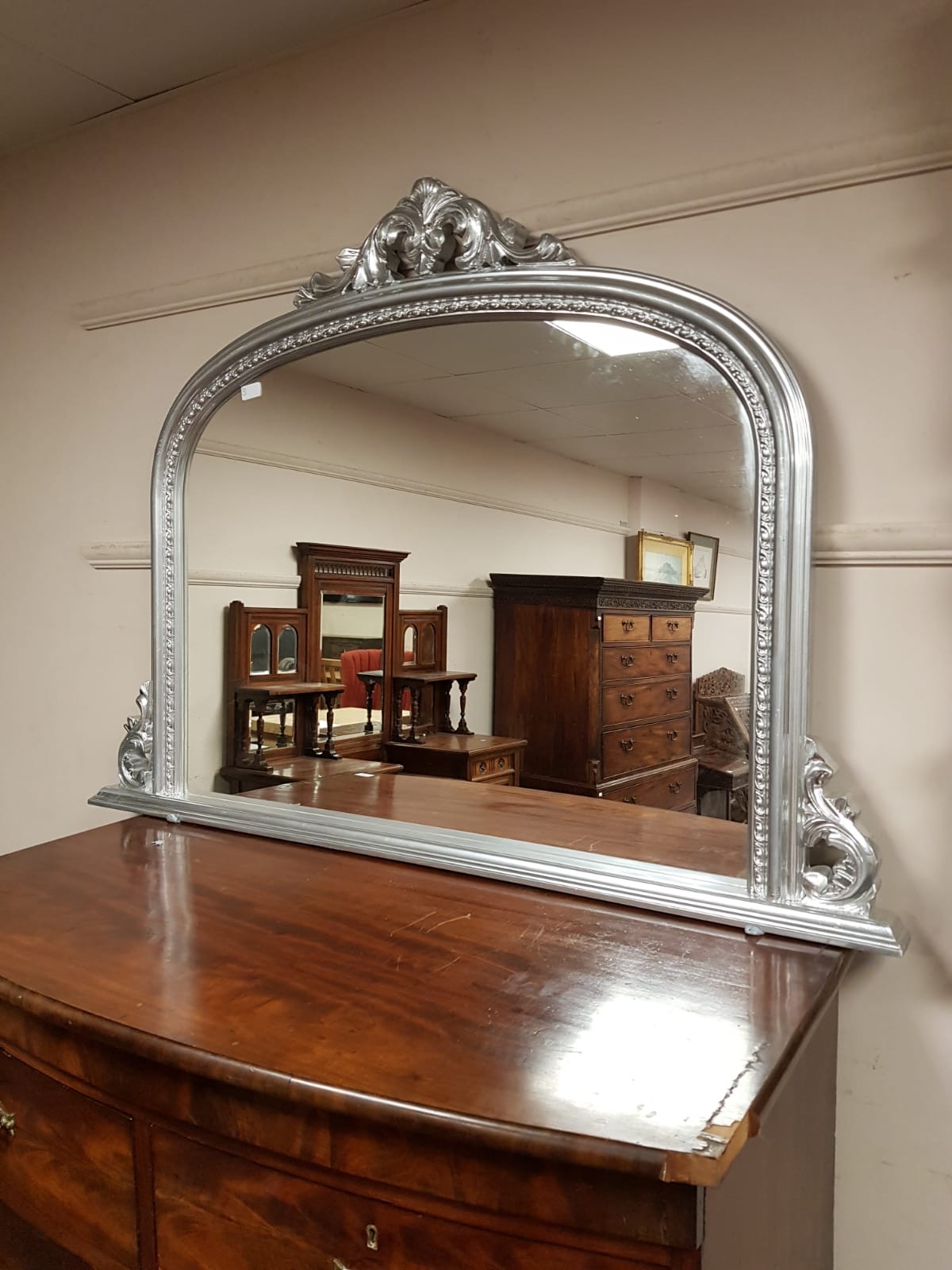 A silvered framed overmantel mirror,