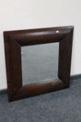 A contemporary hardwood framed mirror