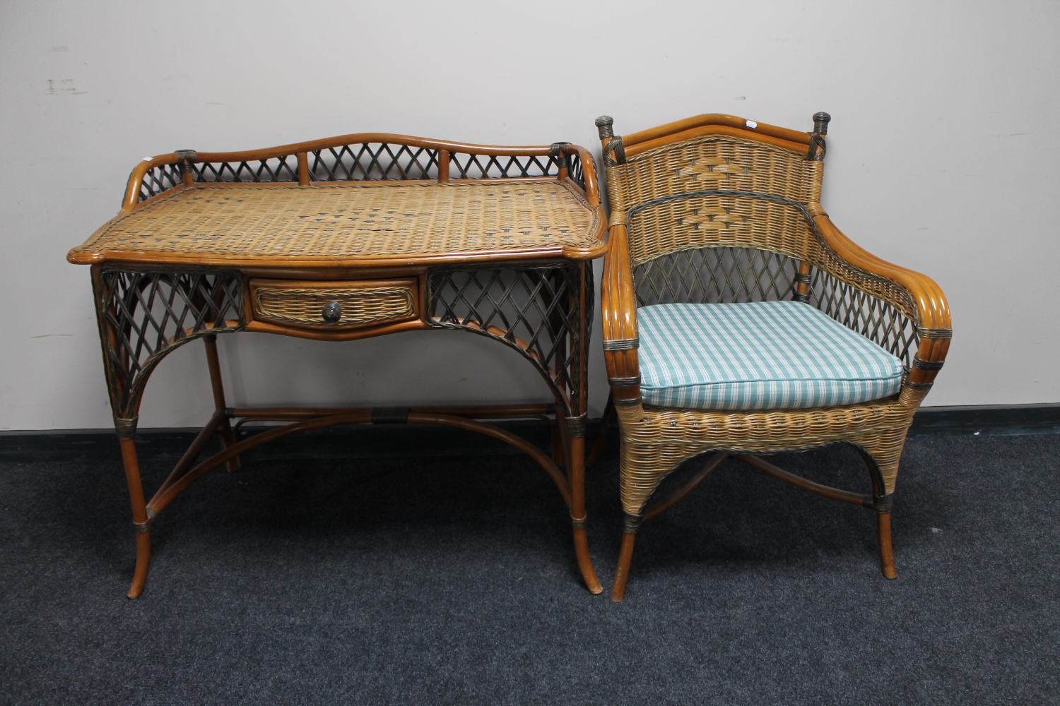 A bamboo and wicker dressing table fitted a drawer together with a bamboo and wicker armchair