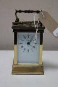 A French brass cased Angelus carriage clock with key