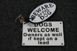 Two cast iron dog signs