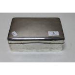 A silver cigarette box,